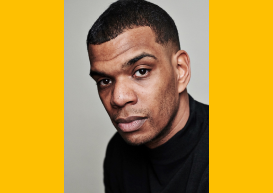 A headshot of a Black man with short hair. 