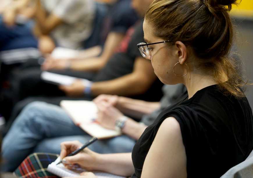 A workshop participant taking notes.