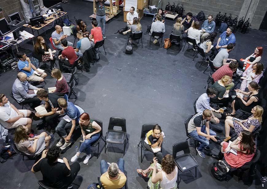 Image of a group of people sat in a circle