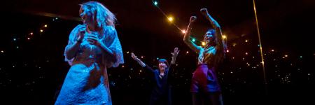 Production photo from Yerma by Johan Persson of the cast partying in the festival scene.